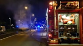 Blussen van in brand staande taxi
